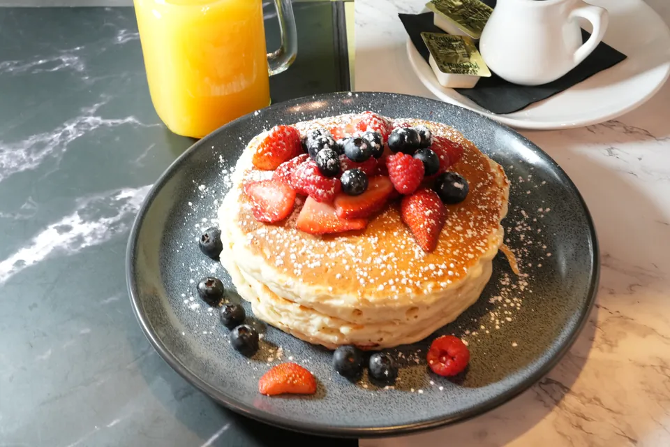 Triple berry pancakes with strawberries, blueberries and raspberries